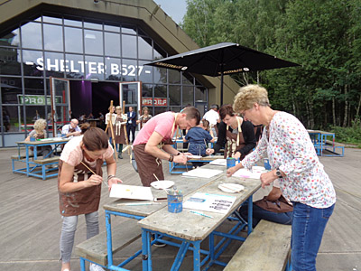 workshop puzzelschilderij voor Universiteit Twente op vliegveld Twente